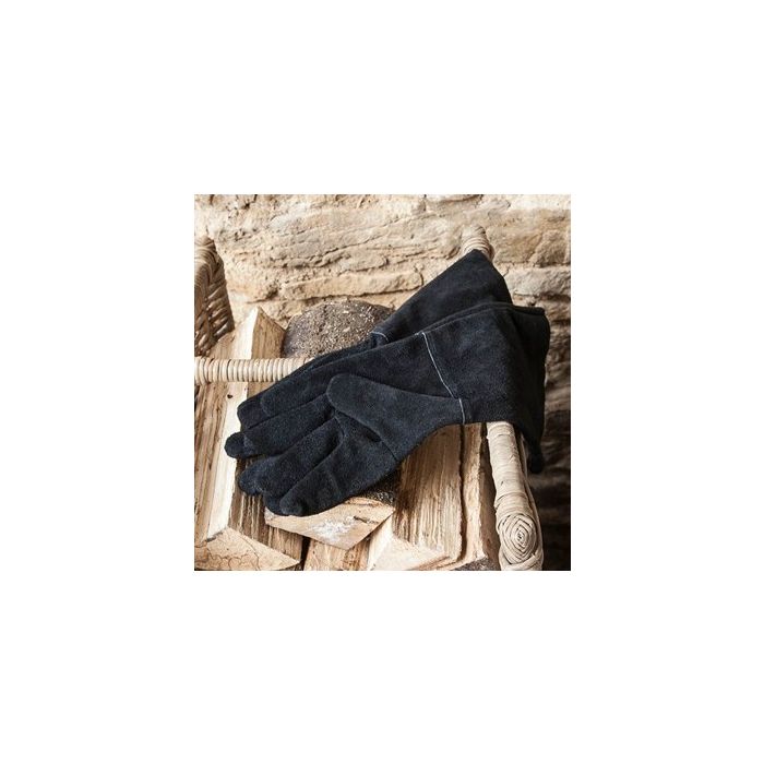 Photograph of Garden Trading Gauntlets in Black Suede on log pile.